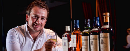 Grame McDowell drinking a Ballantine whisky