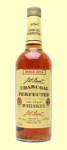 A bottle of J W Dant Charcoal Perfected Whisky