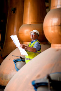 Operations manager Hamish Proctor looks over plans by Chivas Brothers to reopen Glen Keith Distillery in Speyside