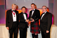 Alan Winchester and Desmond Payne collect the Distiller of the Year Award at the IWSC