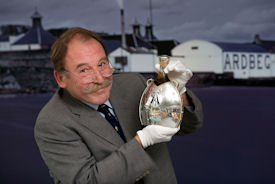 Charles MacLean with the rare 1974 Ardbeg, in bottle designed by Maeve Gillies