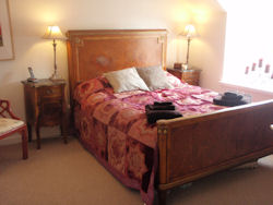 The bedroom at this cottage neat the Strathisla Distillery