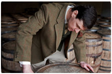Dr.Bill Lumsden, Head of Whisky Distiling and Whisky Creation inspecting barrels