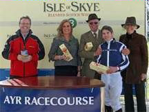  Iain Weir, Marketing Director Ian Macleod Distillers Ltd. presents Harriet's Girl winning team of the 16 September Isle of Skye Blended Scotch Whisky Handicap Stakes with bottles of Isle of Skye 8 Years Old Scotch. (Left to right: Iain Weir, Marketing Director Ian Macleod Distillers Ltd., Trainer Mrs K Burke, Owners Mr & Mrs Ray Bailey and winning jockey, Andrew Elliott.) 